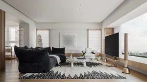 Modern living room featuring wooden flooring, glass walls, and leather furniture.