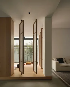 Modern living room featuring wooden floors and glass walls