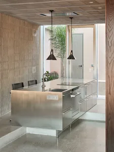 A modern kitchen with metallic features.