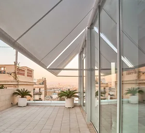 Modern minimalist terrace featuring concrete flooring and a views of the cityscape.