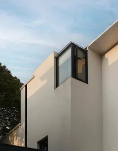 Modern building exterior with concrete and glass materials.