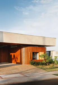 An architectural photo showcasing a modern building exterior with concrete and wood elements.