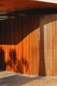 Wooden wall with a shadow of a tree