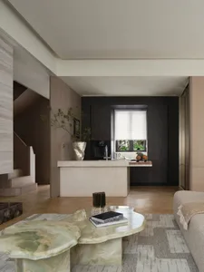 Modern living room with marble coffee table, wooden sofa, and glass window