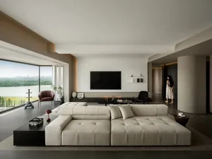 A contemporary living room featuring a large, plush fabric sofa with a minimalist design, complemented by a large window offe