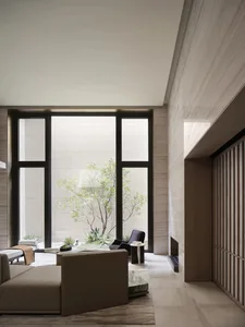 A modern, minimalist living room with neutral-colored furniture, large windows, and a minimalist design.