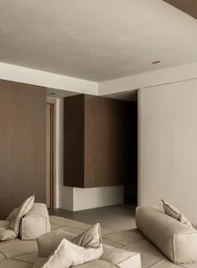 Modern minimalist room with wooden panels on the walls and ceiling, minimalistic furniture.