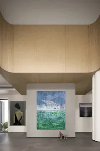Modern art gallery interior with large abstract artwork and wooden walls