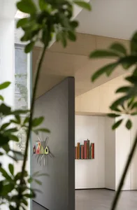 Modern entryway featuring a glass panel wall