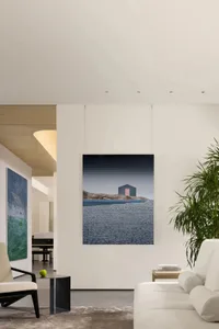 A modern interior living room featuring abstract paintings with a minimalist design.