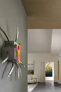 Modern residential interior with a colorful metal wall art installation.