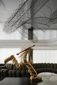 A modern interior design featuring metal wire art installations.