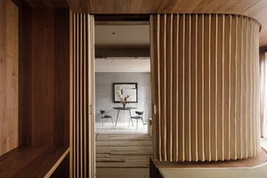 Modern residential interior with wooden curtains and exposed concrete walls