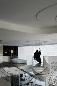 A modern living room featuring a glass balustrade