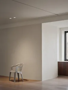 A minimalist interior design featuring neutral tones and simple lines.