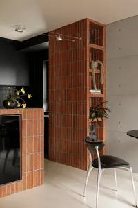 Modern industrial kitchen with brick and concrete split-level design