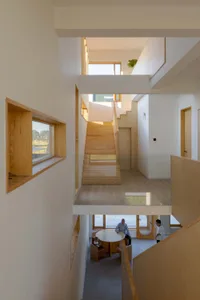 A modern residential interior with wooden architectural features.