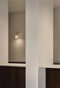 An interior design featuring minimalist decor with concrete walls.