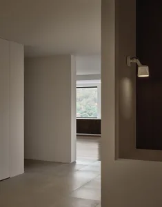 Modern minimalist interior with concrete walls and floor, showcasing clean lines and simplicity.