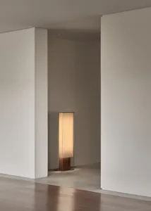 Minimalist floor lamp with wooden base and fabric shade