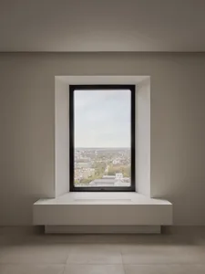 Modern window overlooking a cityscape with a metal frame.
