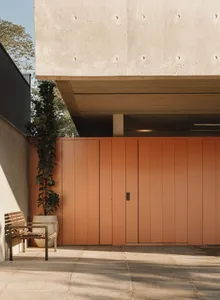 A minimalist modern building facade constructed with concrete panels.