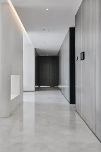 Modern condo interior featuring concrete flooring and minimalist design.