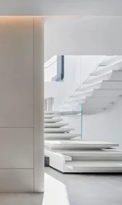 Modern interior staircase crafted from concrete materials.