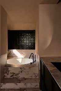 Modern minimalist bathroom interior with marble elements