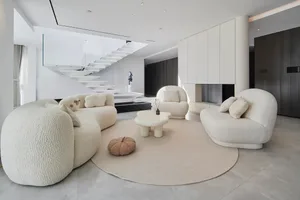 A minimalist living room with concrete tiles and modern design elements.