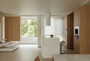 Modern residential kitchen interior with wood and marble finishes