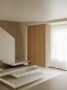 Modern, minimalist staircase with concrete steps and railings.