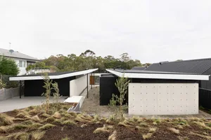 A modern house with concrete walls and a minimalist design.