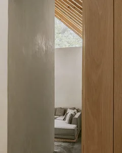 Modern living room with concrete and wooden walls and ceiling