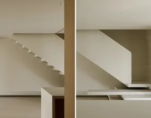 Modern staircase featuring clean lines and minimalist design, constructed from white concrete.