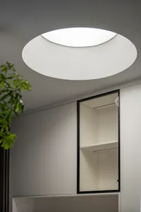 Modern minimalist interior with a glass panel wall closet