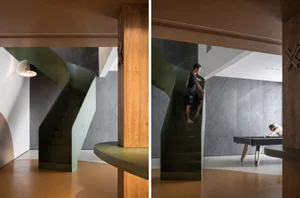 A modern residential interior featuring a concrete spiral staircase.
