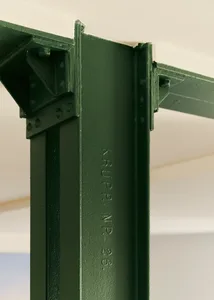 Industrial-style structural steel column with visible markings.