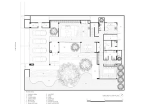 A 2D architectural drawing of a modern house's ground floor layout, featuring a garage, foyer, living room, dining room, bedr