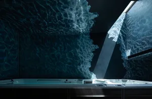 Concrete bathtub with wave-like water effect in the background