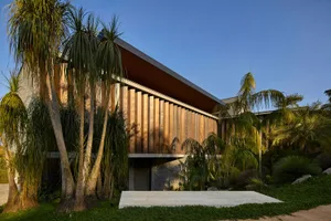 A modern architectural design featuring wooden exterior materials.