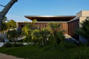 Modern house exterior with wooden and glass elements