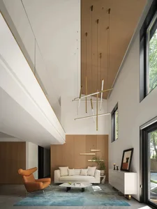 Modern living room with white sofa, brown armchair, and blue rug, featuring wood paneling, leather furniture, and marble coff