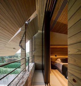 Modern bedroom featuring wood paneling and minimalist design