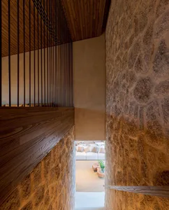 Modern interior space featuring textured concrete walls and minimalist design.