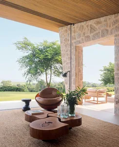 A modern living room with wooden furniture and a view of the outdoors.