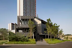 Modern office building with black metal cladding and glass façade exterior