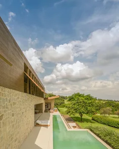 Modern house with a pool and stucco concrete exterior