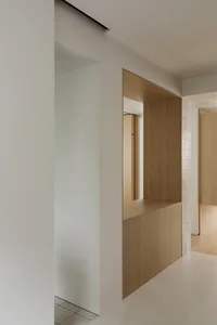 Minimalist room featuring wooden furniture.
