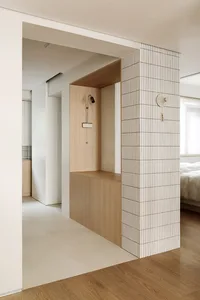 Modern bathroom with wooden elements and clean design.